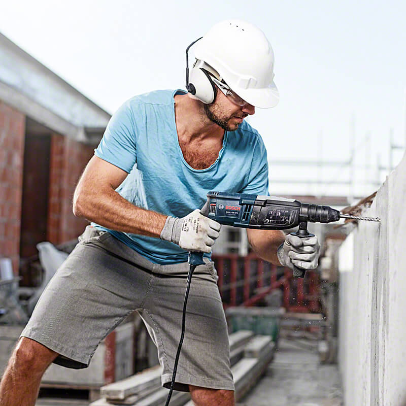 Rotary hammer drilling into concrete